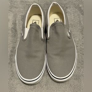 Brand new, never worn Vans men’s size 9.5 gray slip on shoes